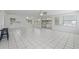 Bright living room features tile flooring, recessed lighting, and sliding glass doors to the lanai at 3240 Flamingo Ln, Mulberry, FL 33860