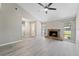 Spacious living room with a stone fireplace and neutral colors to match any style at 3240 Flamingo Ln, Mulberry, FL 33860