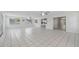 A brightly lit open living space with tile floors and stainless steel appliances nearby at 3240 Flamingo Ln, Mulberry, FL 33860