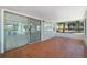 Enclosed screened porch with tiled flooring provides additional living space at 3240 Flamingo Ln, Mulberry, FL 33860