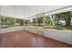 Enclosed screened porch with tiled flooring and a backyard view at 3240 Flamingo Ln, Mulberry, FL 33860