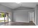 Bright living room with sliding glass doors and hardwood floors at 518 Marion Oaks Trl, Ocala, FL 34473
