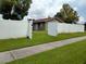 Backyard access through open gates at 11432 Cardiff Dr, Orlando, FL 32837