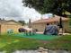 Backyard patio with seating area, grill, and covered spa at 11432 Cardiff Dr, Orlando, FL 32837