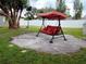 Covered patio swing set in the backyard at 11432 Cardiff Dr, Orlando, FL 32837