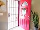 Inviting red front door welcomes guests into the home at 11432 Cardiff Dr, Orlando, FL 32837