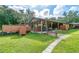 Equestrian barn featuring a spacious interior and a chicken coop next to the barn on the left side at 4292 Sw 73Rd Trl, Bushnell, FL 33513