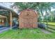 Outside view of the wooden barn with a covered lean-to structure at 4292 Sw 73Rd Trl, Bushnell, FL 33513