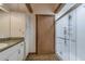 Bright bathroom featuring a glass enclosed shower, wooden accents, and ample storage space at 4292 Sw 73Rd Trl, Bushnell, FL 33513