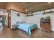 Cozy bedroom with wood ceilings and accents, and warm lighting at 4292 Sw 73Rd Trl, Bushnell, FL 33513