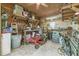 Inside the garage with tools and a Gravely ZT XL zero turn lawn mower at 4292 Sw 73Rd Trl, Bushnell, FL 33513