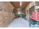 View of the garage with power tools and a zero turn lawn mower at 4292 Sw 73Rd Trl, Bushnell, FL 33513
