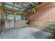 Inside of one of the horse stalls with wooden walls at 4292 Sw 73Rd Trl, Bushnell, FL 33513