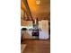 Farmhouse style kitchen boasting stainless steel appliances and light colored cabinetry under exposed wood ceiling beams at 4292 Sw 73Rd Trl, Bushnell, FL 33513