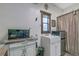 Practical kitchenette area featuring a sink, microwave, and mini-refrigerator for convenience at 4292 Sw 73Rd Trl, Bushnell, FL 33513