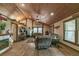 Spacious living room with vaulted wooden ceilings, neutral paint, and an open concept design at 4292 Sw 73Rd Trl, Bushnell, FL 33513
