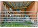 View of the interior of a storage shed with a covered lean-to structure at 4292 Sw 73Rd Trl, Bushnell, FL 33513