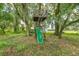 Backyard treehouse with slide and mature landscaping at 4292 Sw 73Rd Trl, Bushnell, FL 33513