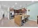 Kitchen featuring stainless steel appliances, granite countertops, and an island with bar seating at 17531 Placidity Ave, Clermont, FL 34714