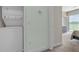 Laundry area with washer and dryer conveniently located near the bedroom at 17531 Placidity Ave, Clermont, FL 34714