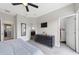 Spacious main bedroom featuring modern furnishings, a walk-in closet and ensuite bathroom at 17531 Placidity Ave, Clermont, FL 34714