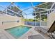 Screened-in pool area with lounge chairs at 17531 Placidity Ave, Clermont, FL 34714