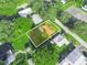 Aerial view of property surrounded by verdant lawn and established trees at 5337 Jacob Ave, Polk City, FL 33868