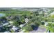 Aerial perspective of homes nestled among lush trees and waterways at 5337 Jacob Ave, Polk City, FL 33868