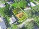 Home aerial view surrounded by green lawns, mature trees, defined by property lines at 5337 Jacob Ave, Polk City, FL 33868