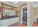 Main bathroom with double vanity, large mirror, and glass enclosed shower at 8847 Rose Hill Dr, Orlando, FL 32818
