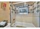 Elegant bathroom featuring a glass-enclosed shower and classic tile work at 8847 Rose Hill Dr, Orlando, FL 32818