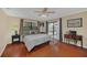 Spacious bedroom with sliding door to the patio and a decorative desk at 8847 Rose Hill Dr, Orlando, FL 32818