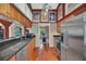 Charming kitchen with stainless-steel appliances, wooden cabinets, and hardwood floors at 8847 Rose Hill Dr, Orlando, FL 32818