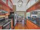 Modern kitchen featuring dark countertops, stainless steel appliances, and wooden floors at 8847 Rose Hill Dr, Orlando, FL 32818