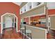 Modern kitchen with breakfast bar, stainless steel appliances and stylish backsplash at 8847 Rose Hill Dr, Orlando, FL 32818