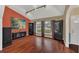 Bright living room features hardwood floors, neutral walls, track lighting and large windows at 8847 Rose Hill Dr, Orlando, FL 32818