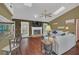 Bright living room with wood floors, ceiling fan and access to outside at 8847 Rose Hill Dr, Orlando, FL 32818