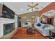 Bright living room with fireplace, wood floors, and comfortable seating at 8847 Rose Hill Dr, Orlando, FL 32818