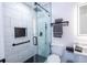 Modern bathroom featuring a glass-enclosed shower with a rainfall showerhead and a sleek vanity at 7036 Mapperton Dr, Windermere, FL 34786