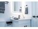 Modern bathroom featuring sleek fixtures, vanity, and a well-lit LED mirror at 7036 Mapperton Dr, Windermere, FL 34786