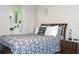 Bedroom showcasing a comfortable bed, side table, and ensuite bathroom with modern fixtures at 7036 Mapperton Dr, Windermere, FL 34786