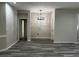 Neutral dining room featuring modern chandelier and flooring, ready for your personal touch at 7036 Mapperton Dr, Windermere, FL 34786