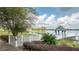 Scenic lake view with a private dock and gazebo, perfect for relaxation at 7036 Mapperton Dr, Windermere, FL 34786