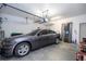 Well-organized garage showcasing a modern car, ample storage, and functional space for convenience at 7036 Mapperton Dr, Windermere, FL 34786