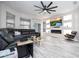 Spacious living room with large sectional sofa, fireplace, and built-in shelving for modern living at 7036 Mapperton Dr, Windermere, FL 34786