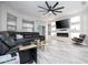 Spacious living room with large sectional sofa, fireplace, and built-in shelving for modern living at 7036 Mapperton Dr, Windermere, FL 34786