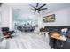 Spacious living room with large sectional sofa, fireplace, and built-in shelving for modern living at 7036 Mapperton Dr, Windermere, FL 34786