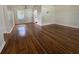 Bright living room with beautiful hardwood floors, neutral paint, and plenty of natural light at 766 Bates Sw Ave, Winter Haven, FL 33880