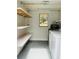 Utility room featuring shelving, washer and dryer at 766 Bates Sw Ave, Winter Haven, FL 33880