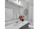 Bathroom featuring a single sink with a white countertop, gray cabinets and a large mirror and towel rack at 29912 Cypress Pointe, Deer Island, FL 32778